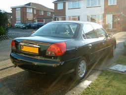 The distinctive rear lights on the facelifted 4dr saloon. This particular car is a 1.8LX finished in Tourmallard Green